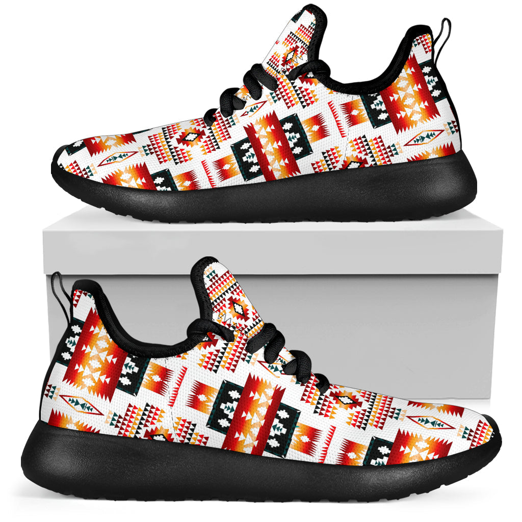 Side view mesh sneakers with red-orange tribal print, black sole on white box