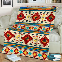 Southwest geometric blanket in cream, red, teal, and yellow with border trim