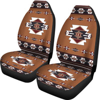 Pair of multicolor Native-inspired car seat covers with central temple emblem, tan and black