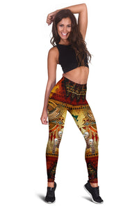 Red, gold and green leggings with geometric pattern and centered owl motif
