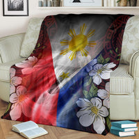 Draped blanket with Philippines flag design: sun center, red/blue panels, floral accents