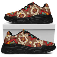 Tan chunky sneakers with black sole, red geometric pattern, lace-up with black eyelets