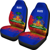 Two Haiti car seat covers with blue headrests, red base, and palm/firework crest