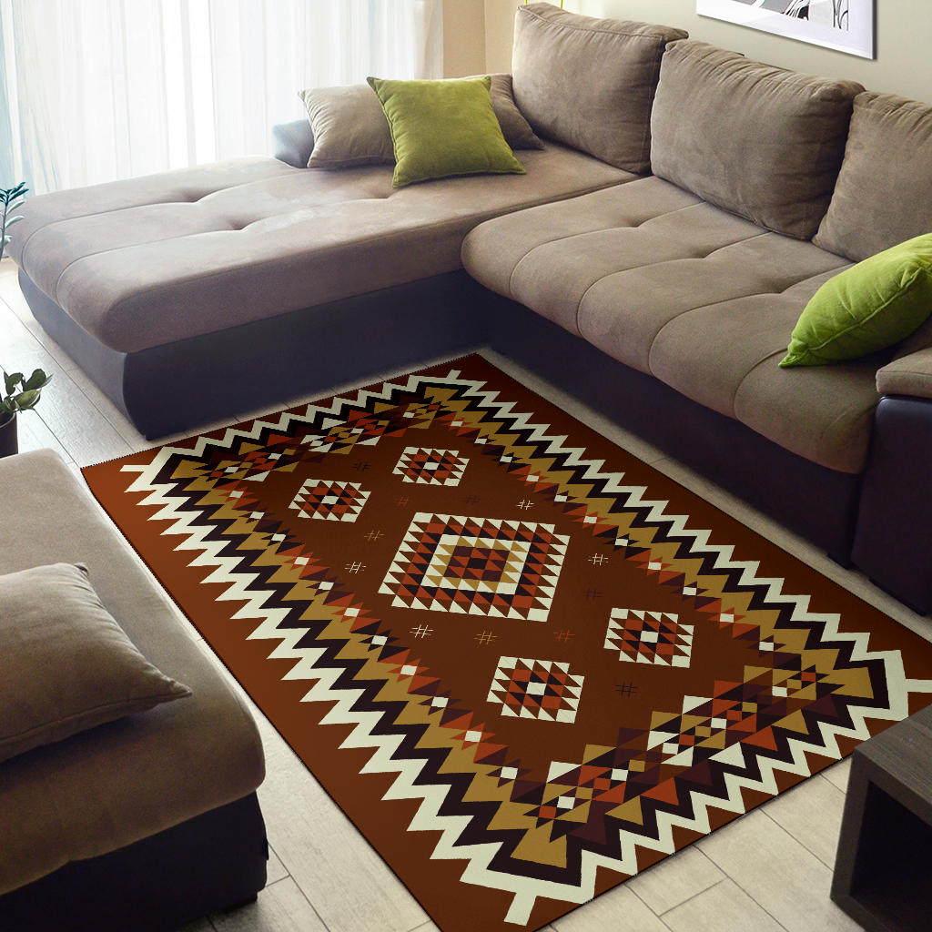 Brown geometric area rug with bold zigzag edge and diamond pattern