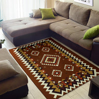 Brown geometric area rug with bold zigzag edge and diamond pattern