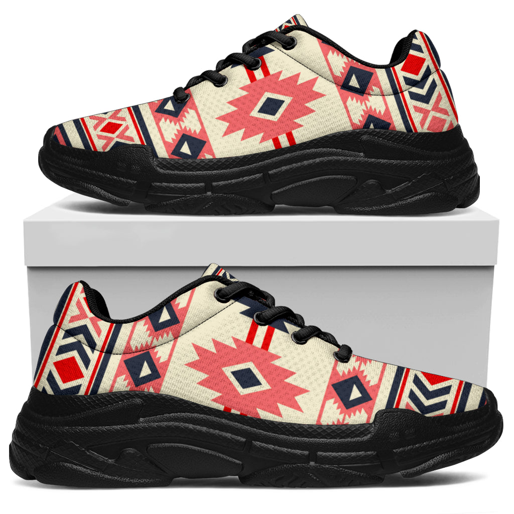 Chunky sneaker side view with cream, pink, and navy tribal pattern; black laces, black sole