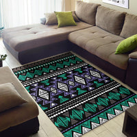 Neon geometric tribal area rug laid flat, teal and purple triangles with white lines on black