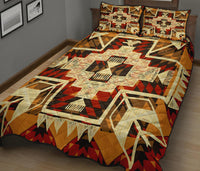 Quilt bed set with large center star and repeating arrow motifs, red black and cream