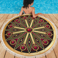 Round mandala beach blanket, dark maroon and gold rays with red ring accents