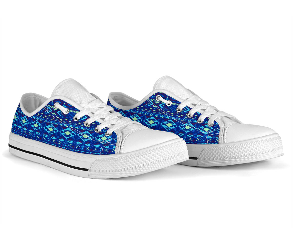 Pair of white low-top sneakers with blue geometric pattern and white laces