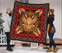 Red border Native-style quilt featuring beaded owl medallion and turquoise geometric edge