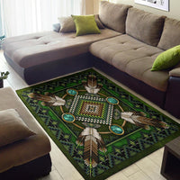 Green area rug with geometric Native pattern, bead-like center design and turquoise rings