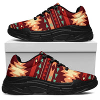 Red tribal pattern chunky sneakers side view, black sole and lace-up front