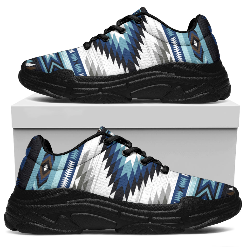 Chunky sneakers with blue, white, and gray zigzag tribal print; black outsole