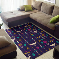 Thunderbird pattern area rug in dark blue with colorful desert symbols, rug centered on floor