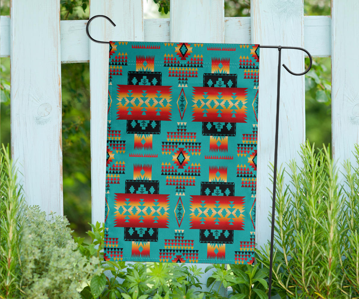 Multicolor geometric pattern house flag hanging on brackets, teal orange red and yellow blocks