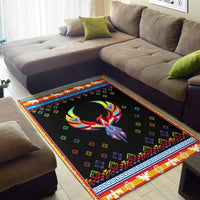 Native American phoenix area rug in black with colorful geometric border on floor