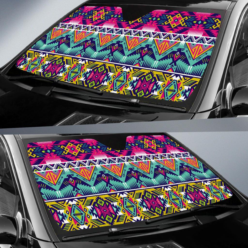 Multicolor geometric sun shade covering car windshield, stripes and diamond motifs
