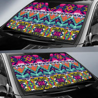 Multicolor geometric sun shade covering car windshield, stripes and diamond motifs