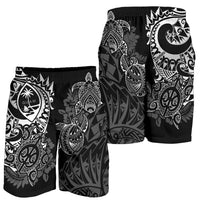 Black men’s swim shorts side view with white floral and turtle tribal design