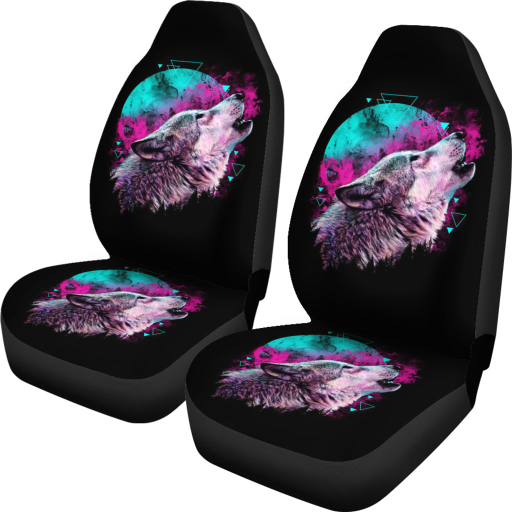 Pair of black car seat covers with neon wolf face graphic on headrest and seat