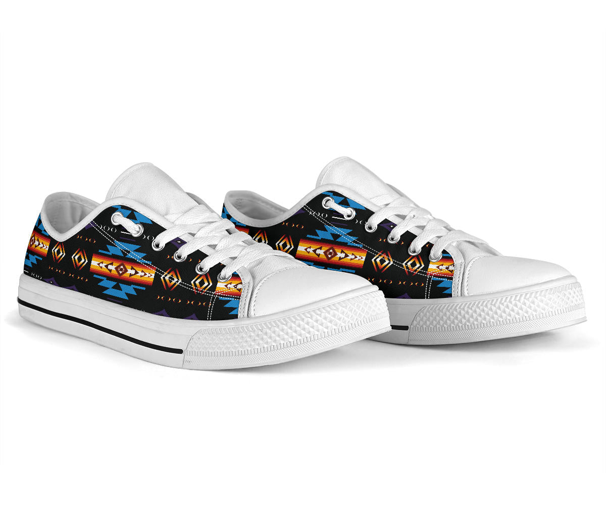 White low-top lace sneakers with blue Native pattern, side view