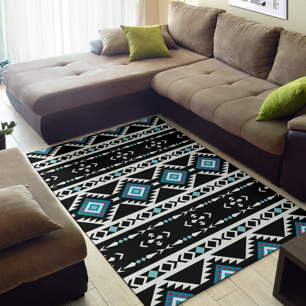 Geometric tribal area rug in black with white zigzags and teal accents