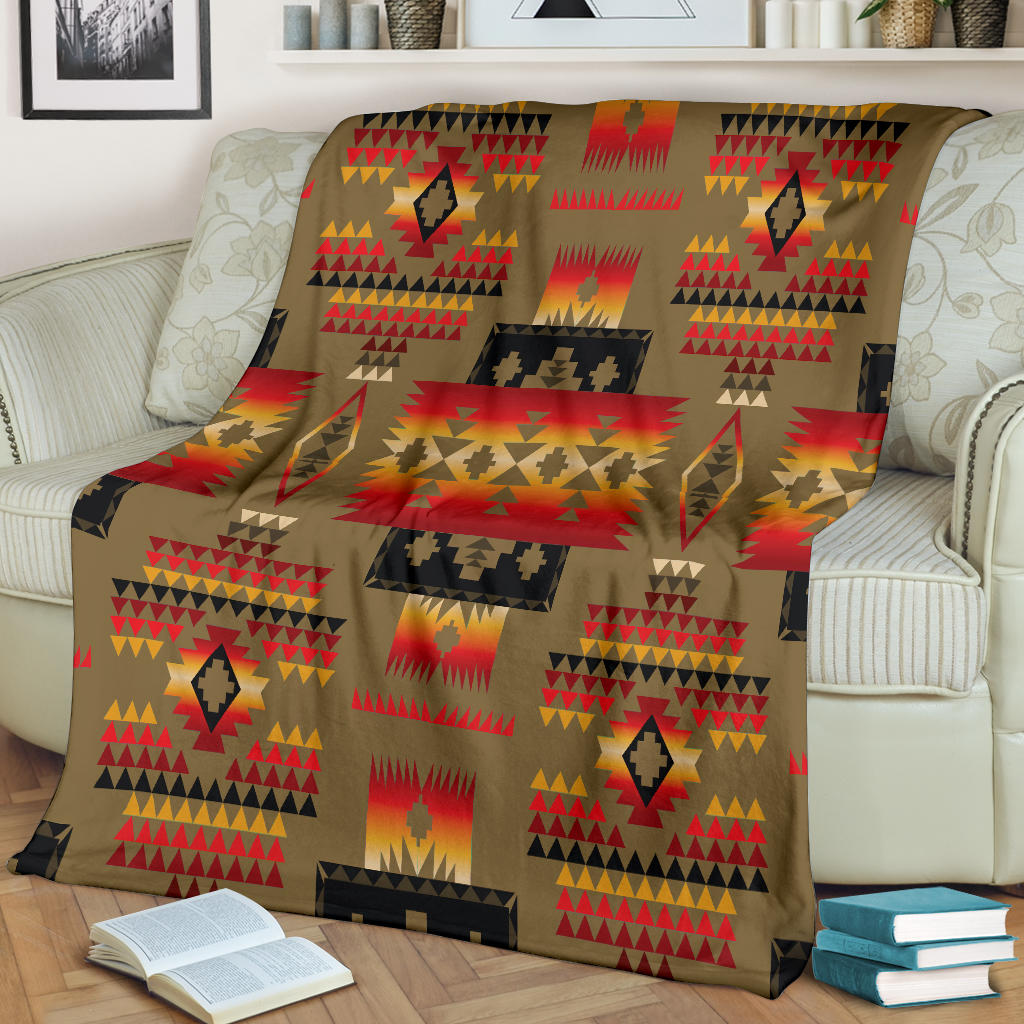 Tribal design blanket, dark brown base with multicolor geometric motifs in red, yellow, black
