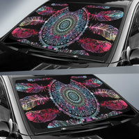 Colorful auto sun shade covering front windshield, featuring circular mandala and feather design