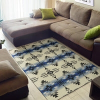 Cream-blue geometric area rug with black triangles and repeating starburst medallion shapes
