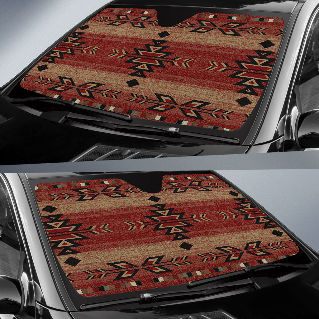 Windshield sun shade spread across car glass, Native geometric pattern in red and beige
