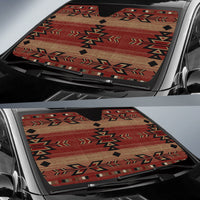 Windshield sun shade spread across car glass, Native geometric pattern in red and beige