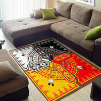 Native American design area rug in red, yellow, black, and white on living room floor