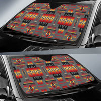 Car windshield sun shade with multicolor geometric squares, diamonds, and red-orange accents