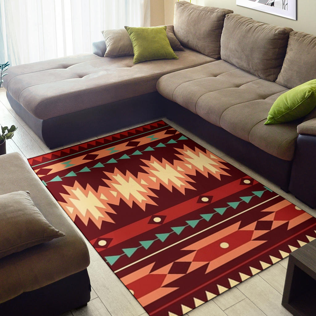 Red geometric area rug with chevrons and zigzags in beige, orange, green, rectangular
