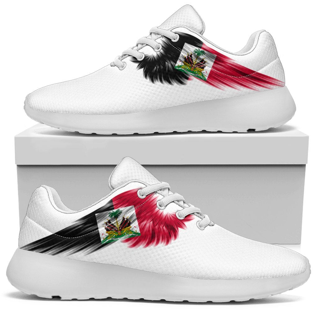 White low-top sneakers with Haiti flag wing graphic on side; black sole and laces