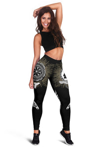 Black women’s leggings with gold texture-style panels and centered circular rune design