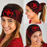 Tribal wave bandana worn over head and eyes, black with red circular Polynesian motif