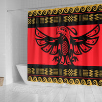 Red shower curtain showing black eagle wings graphic, gold patterned trim