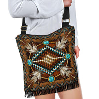 Front on model: brown crossbody with turquoise cabochon beads and woven black fringe trim