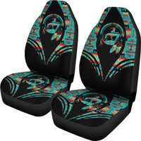 Two seat covers with black base and colorful stylized figure and geometric pattern