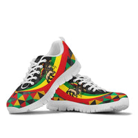 White-soled sneakers pair, Ethiopian rasta lion graphic on multicolor geometric upper
