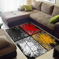 Area rug patchwork design with black, red, yellow, and white paisley blocks and grid lines