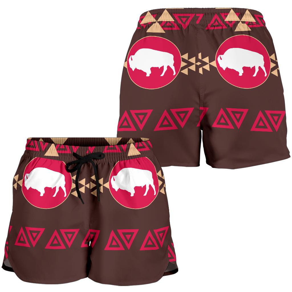 Brown women’s swim shorts with all-over pink bison circles, geometric patterns, elastic waistband