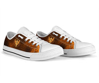 Viking low-top sneakers with white laces and orange-brown upper featuring gold spear/raven design