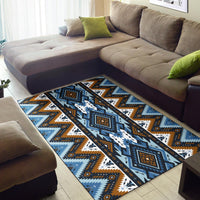 Blue tribal area rug with orange accents, framed squares, zigzags and arrow icons