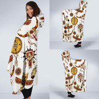 White hooded blanket poncho with colorful Native-style symbols, worn over leggings (side view)