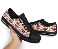Low-top sneakers with multicolor Native-inspired stripes on white canvas and black laces