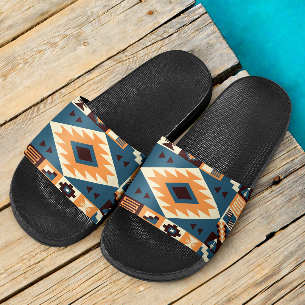 Pair of black slide sandals with multicolor aztec arrow-pattern straps