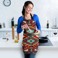 Native-style apron in red and teal with diamond motifs, woman holding baking tray